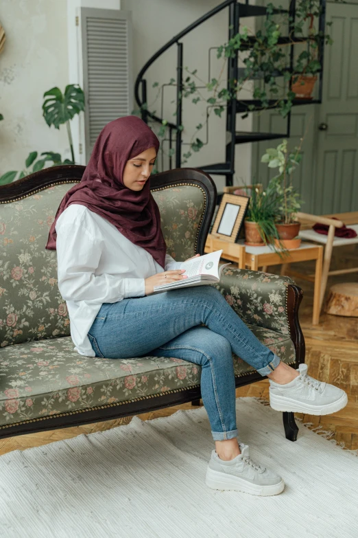 a woman sitting on a couch in a living room