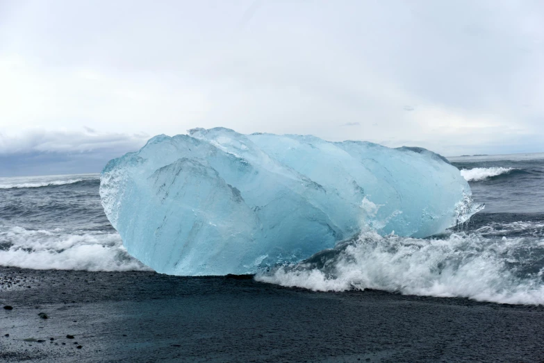 a big iceberg is poking out of the water