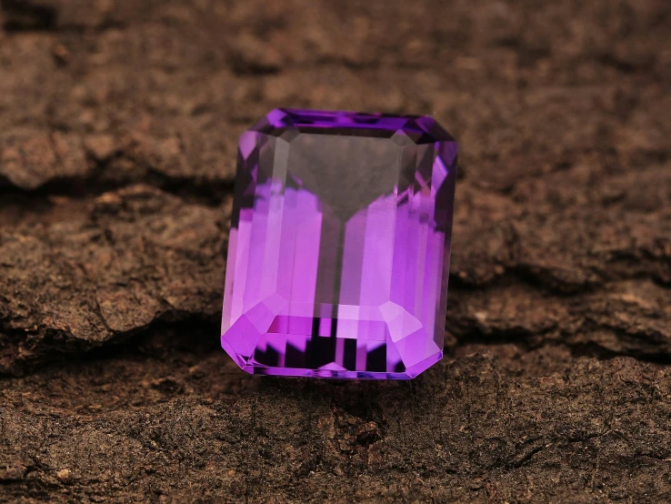 an ayst purple stone sits on the ground