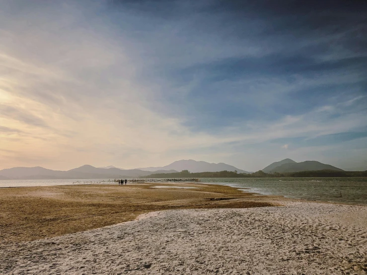 there is a very empty beach by the water