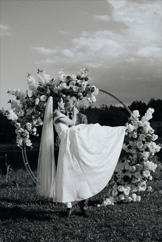 a couple holding hands near an outdoor ring