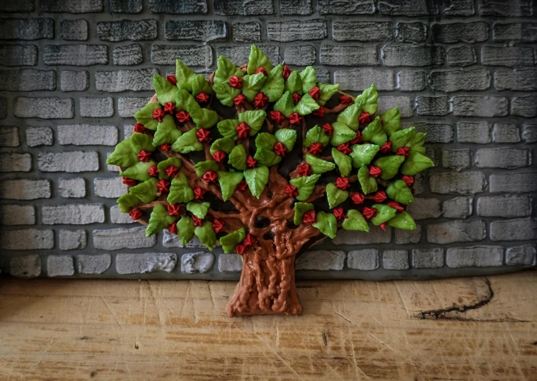 a small figurine of a tree on top of a wooden table