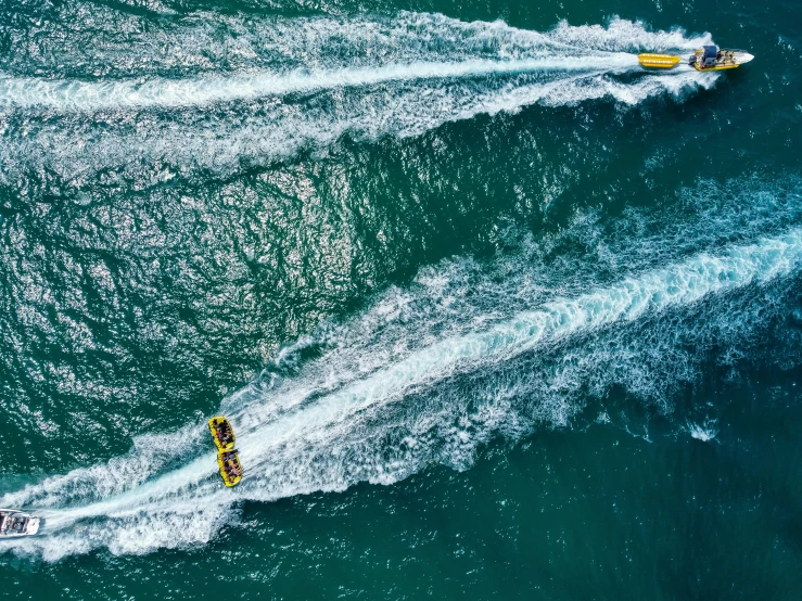 two boats in the water near one another