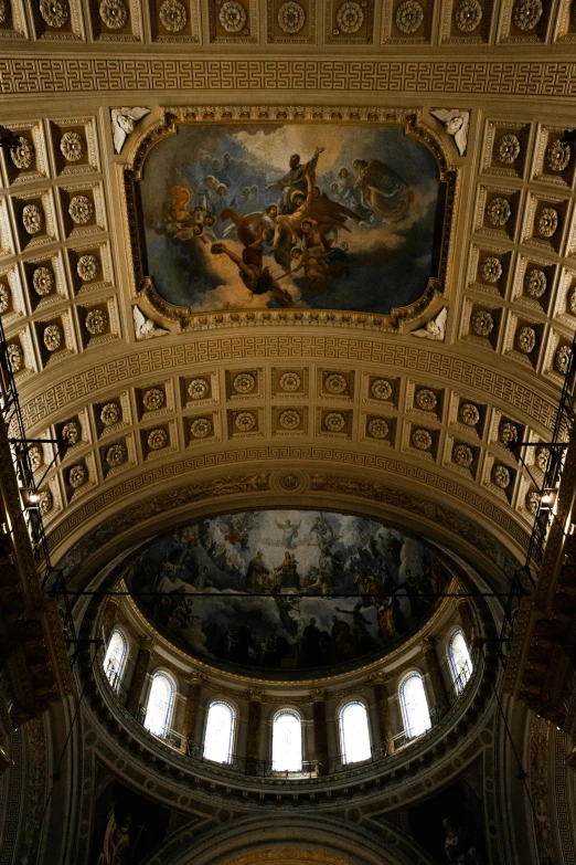 there is an artistic painting on the ceiling