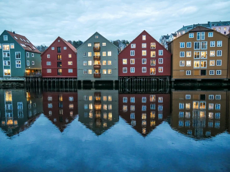 a series of houses sitting in the middle of the water