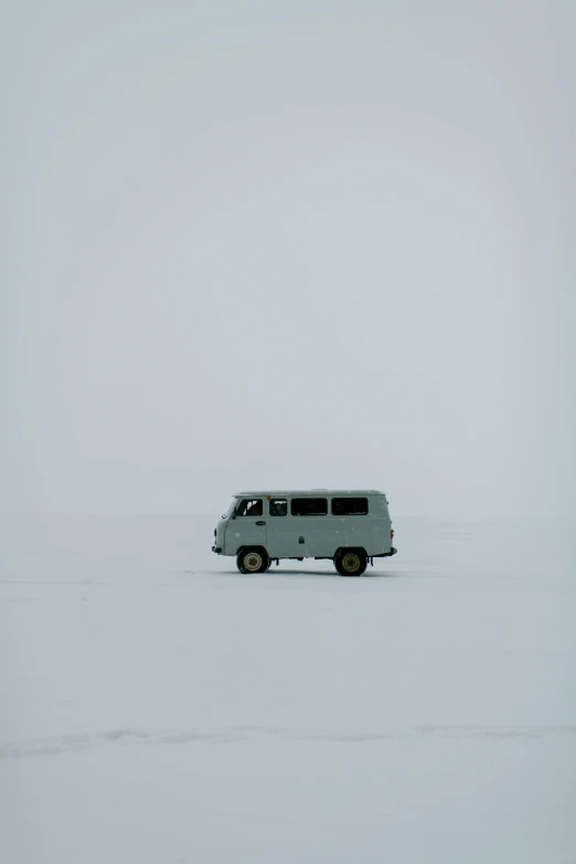 a van parked in the middle of an empty field