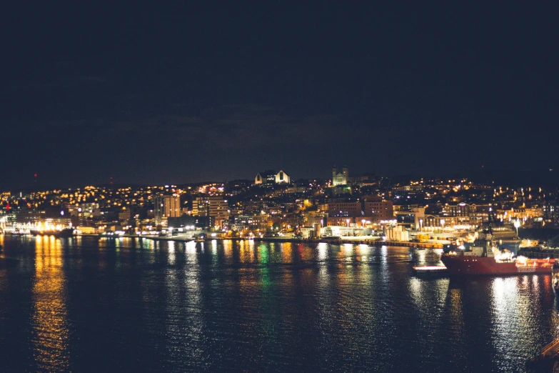 an image of city lights from a dock