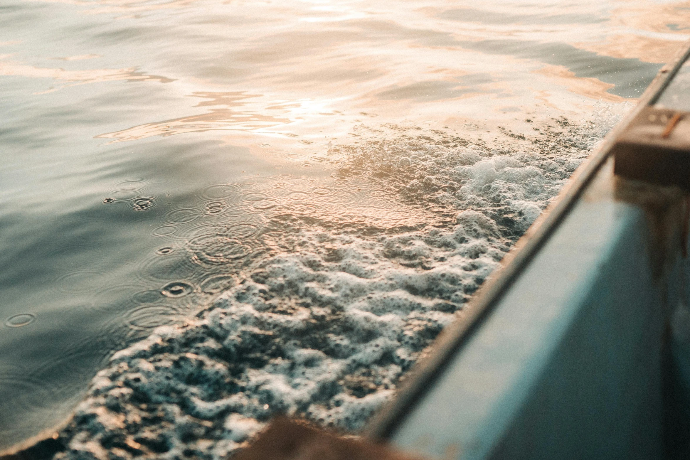 a person standing on the deck of a boat