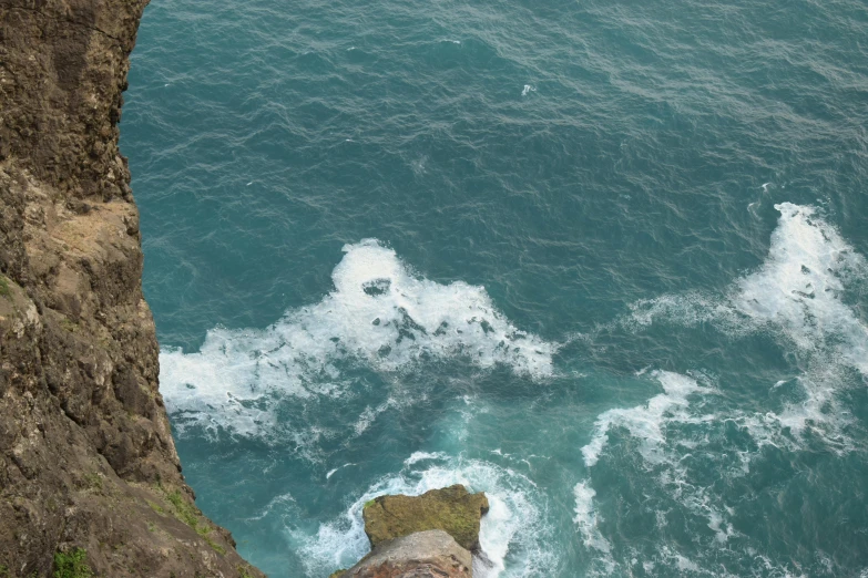 the view from a cliff on a rocky cliff overlooking the ocean