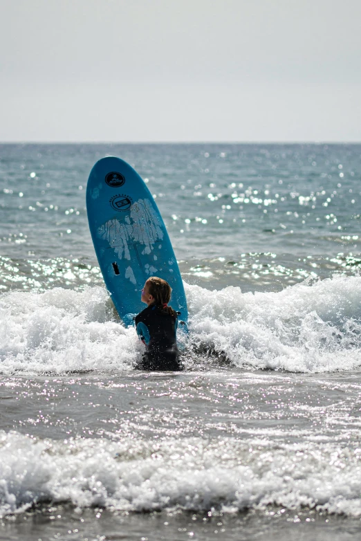 the surfer is about ready to ride the waves