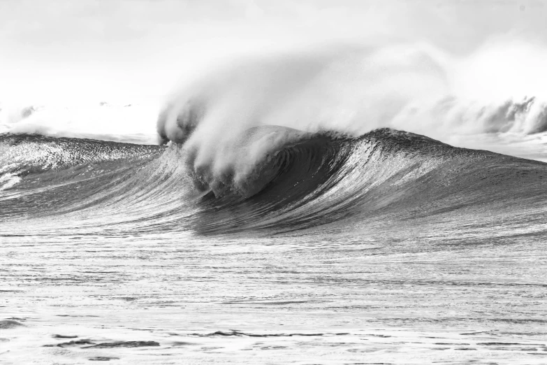 an ocean wave in the air and crashing over it