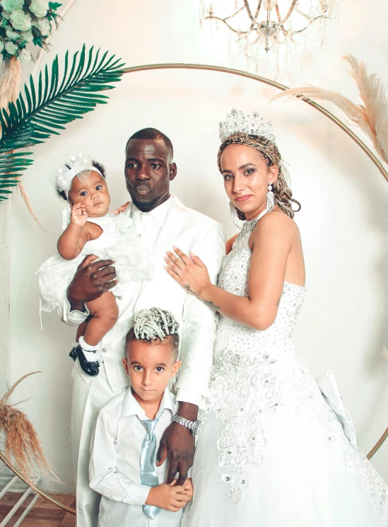 an african american family poses for a wedding portrait