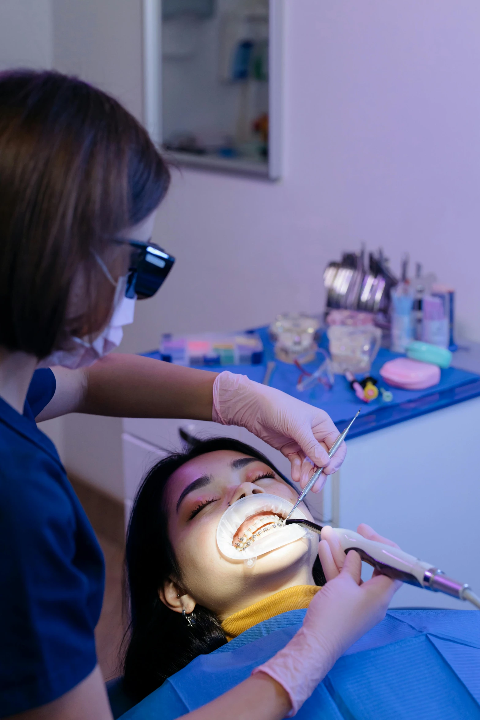 a person in a chair having a face makeover