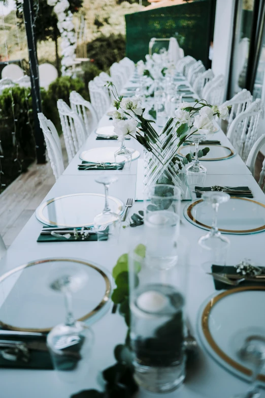 white table setting in an upscale home at dusk