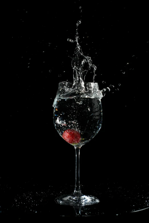 a glass filled with water on top of a table