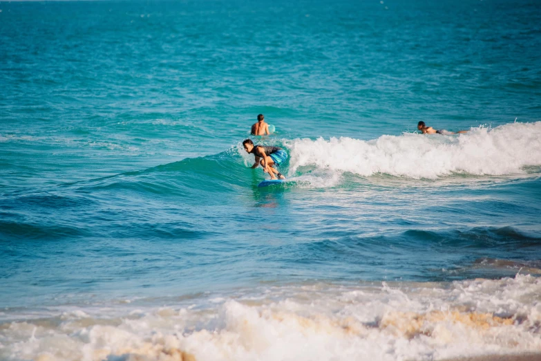 a person riding a wave on a surfboard in the ocean