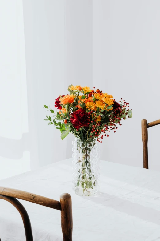 a vase of flowers sitting on a table