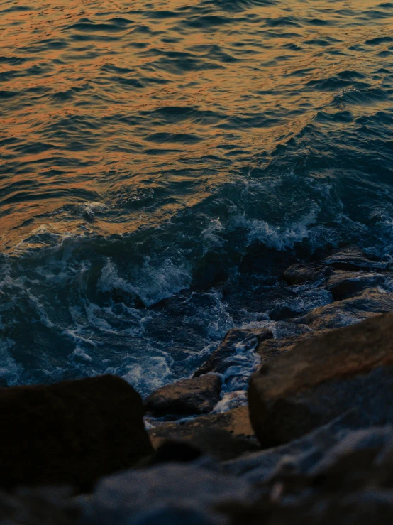 the sky is reflected on the water with waves