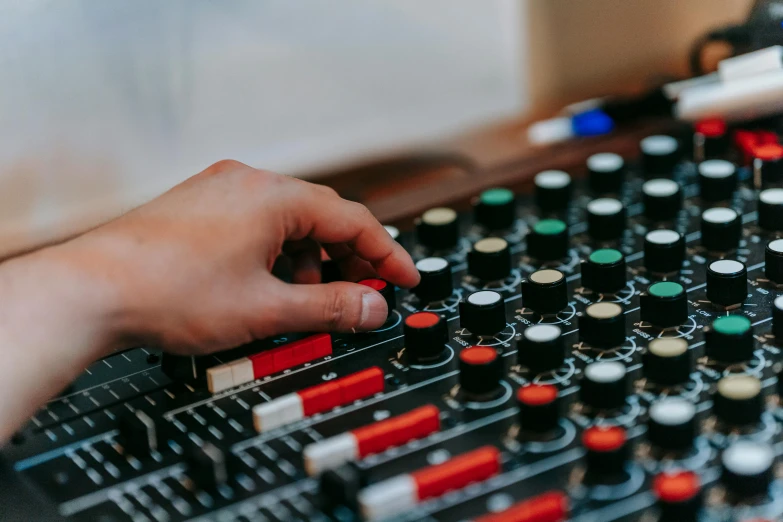 someone is mixing with a mixer on the table