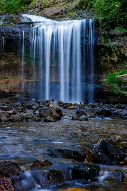 this is an image of a waterfall in the woods