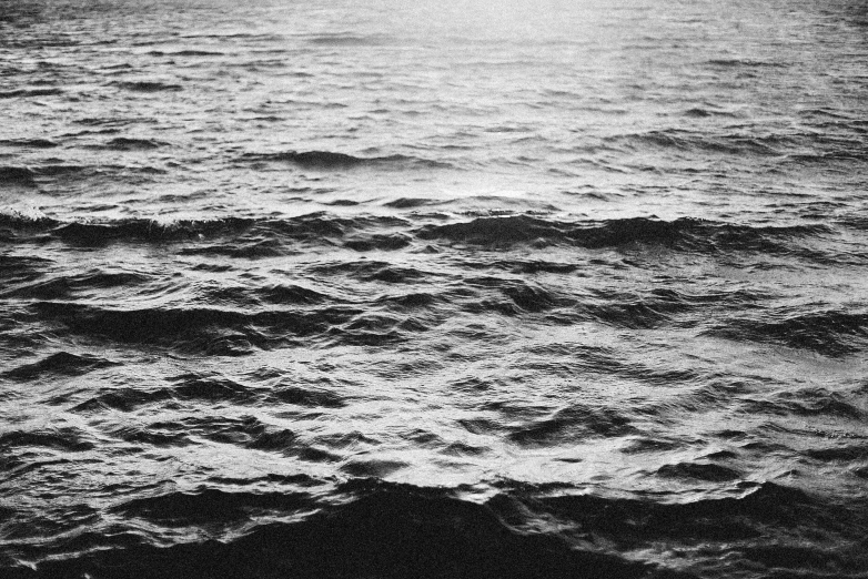 a black and white po of a boat in the ocean