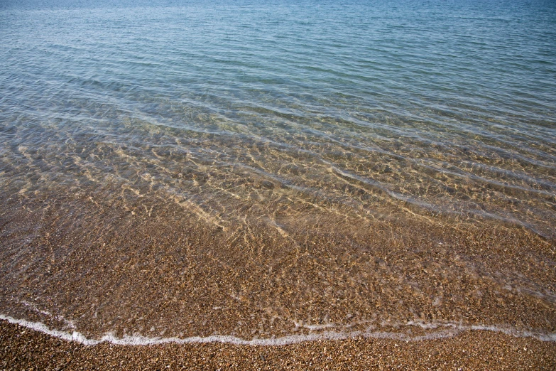 the sand is brown and has two thin waves