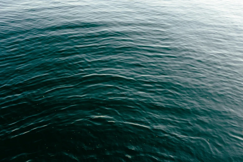 the sky is reflected in the ocean water