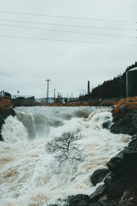 the water is flowing under a bridge