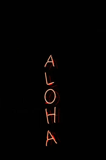 a red neon sign with the word aloha above it