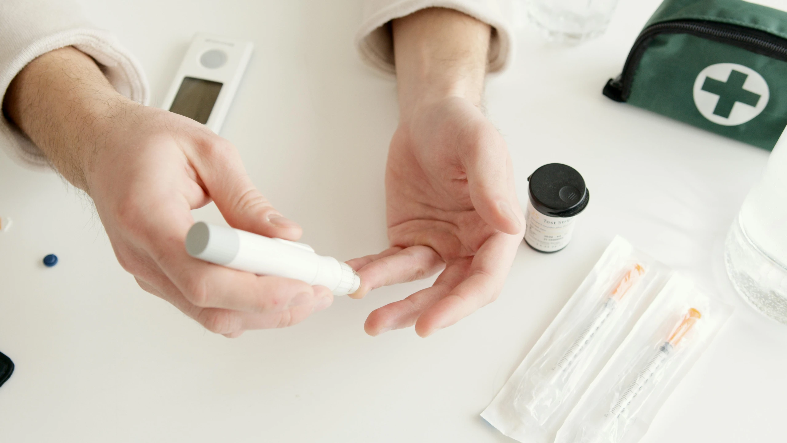 two people hold hands as they make a drug test