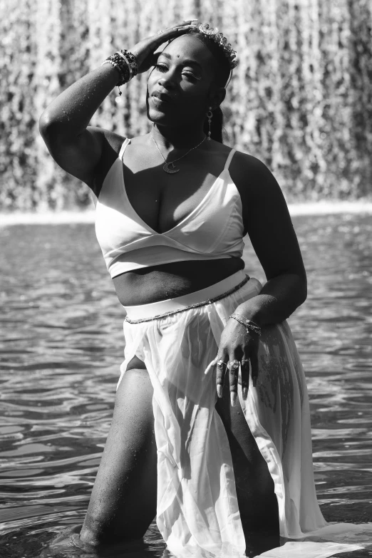 a woman with her eyes closed in a water fountain