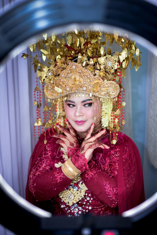 a woman in a traditional costume is posing for the camera