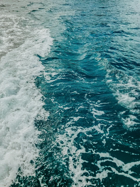 a view down the side of a boat at sea