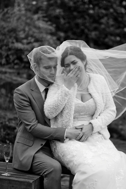 a bride and groom holding each other during their wedding po