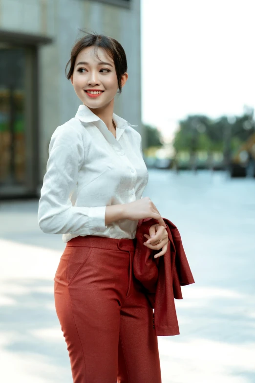 a young lady with a haircut and white shirt