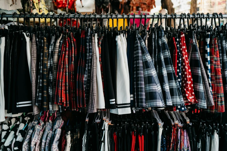 the rack with ties is full of clothes