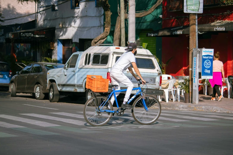 a man riding his bike down the street