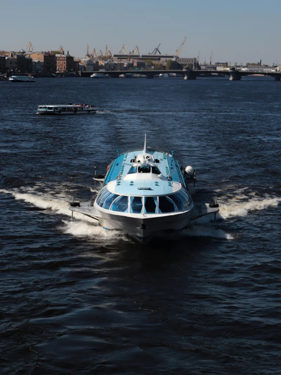 a small boat traveling across a large body of water