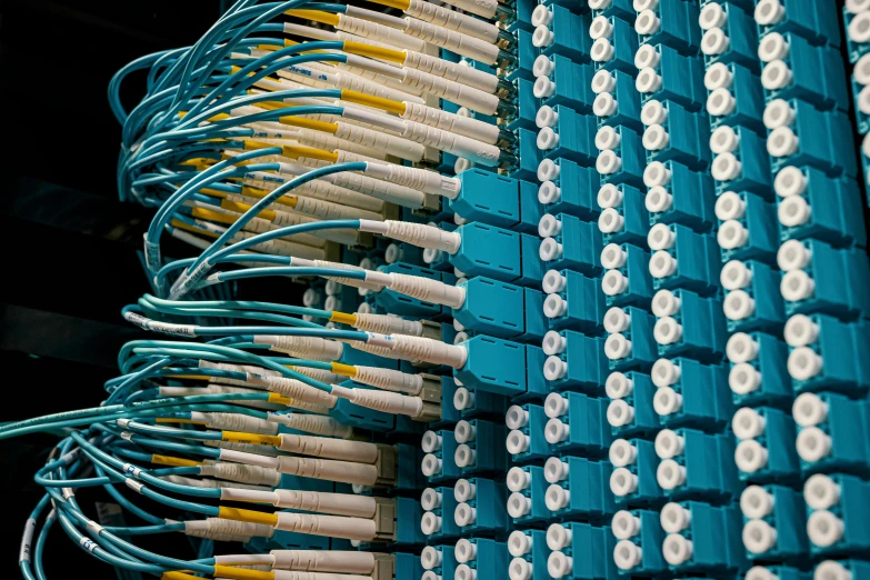 several white and yellow tooth brushes arranged by wires