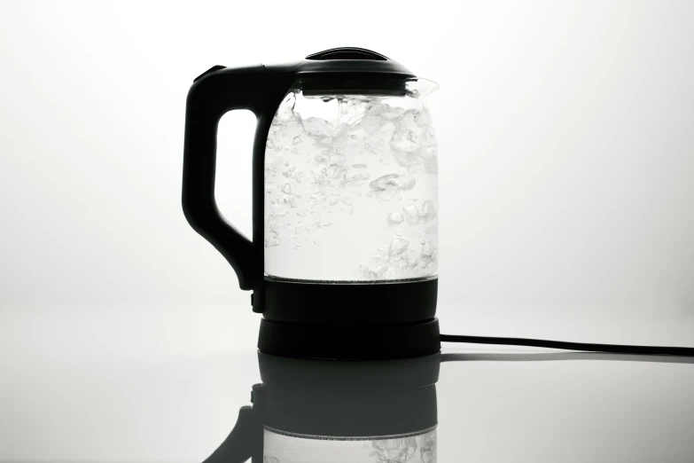 an ironed glass jug filled with liquid