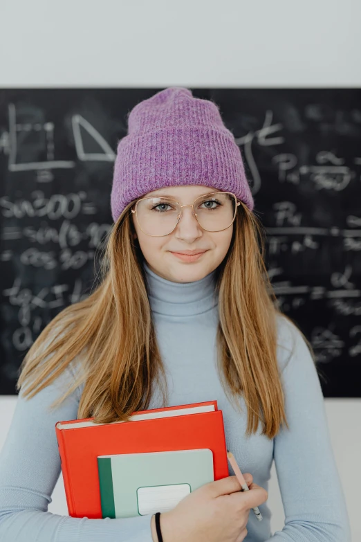 a girl holding an item with several different colors