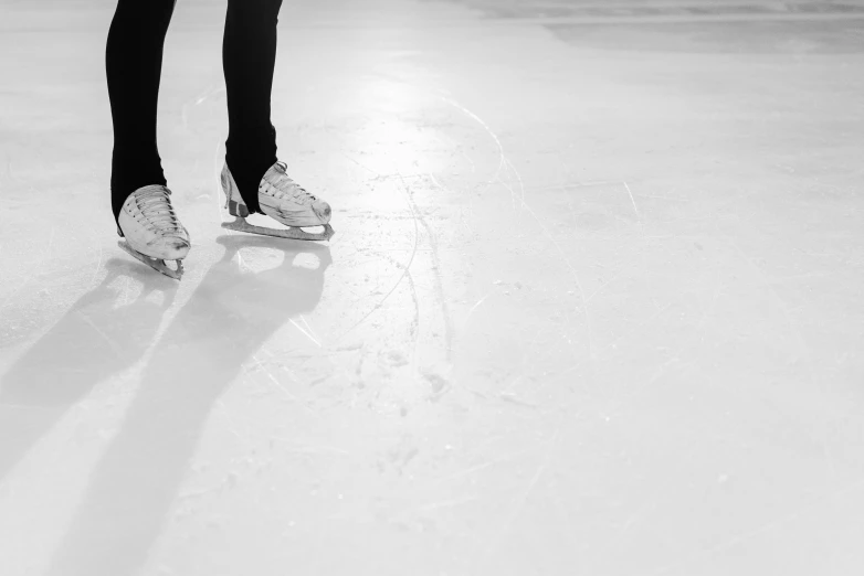 a person in white shirt and black pants skating