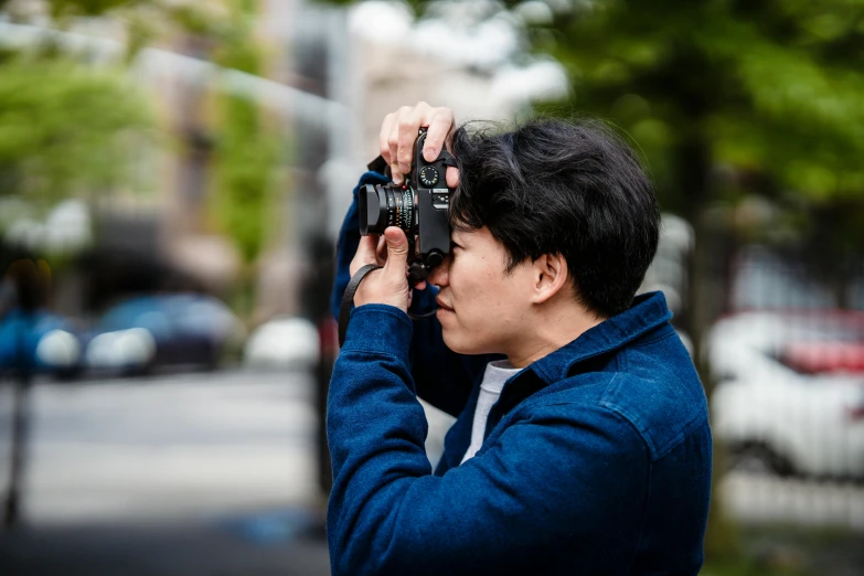 a person holding a camera up to their face