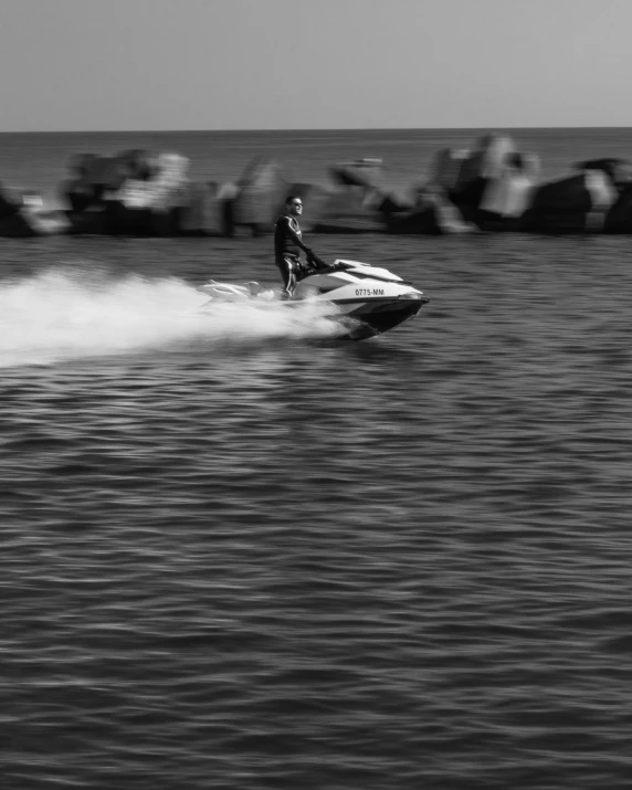 a person riding a surf board on a body of water