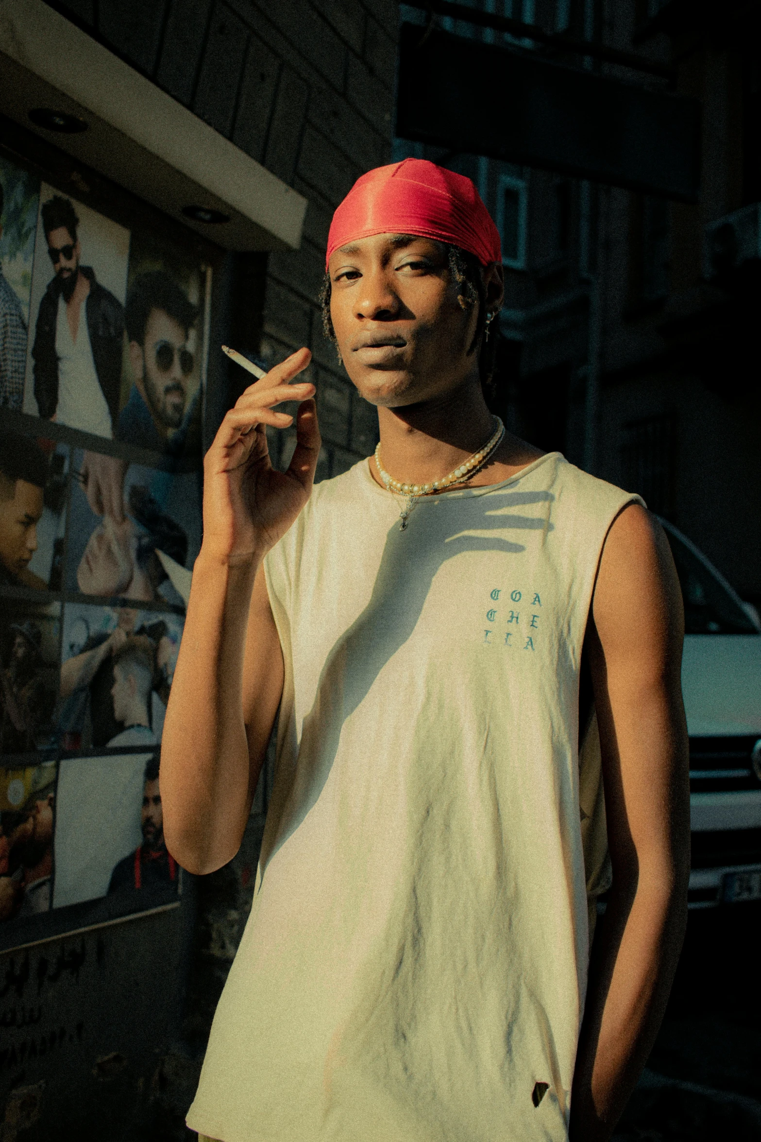 a person with a cigarette and wearing a bandana