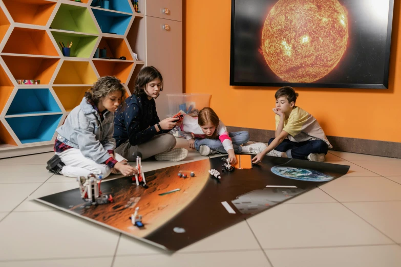 three children working on artwork in front of a painting