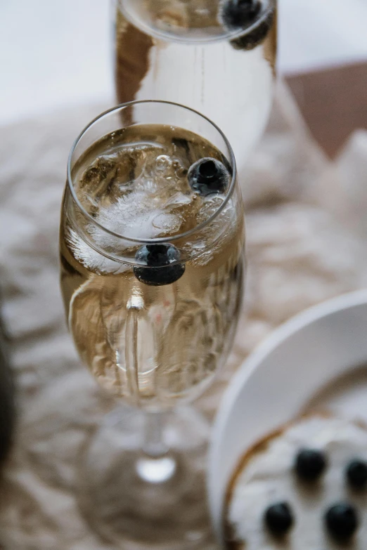 a close up of a wine glass with a liquid in it