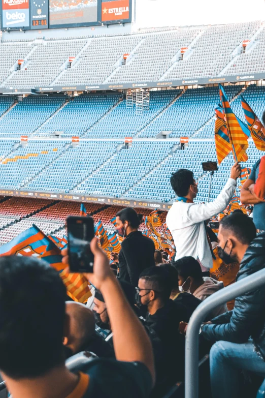 a group of people in an arena watching a game