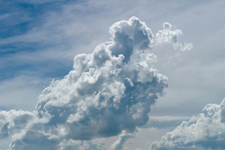 the big clouds are in a blue sky