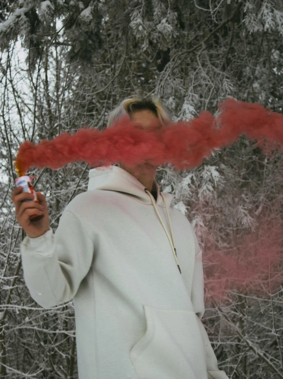 a man in white jacket smoking a cigarette